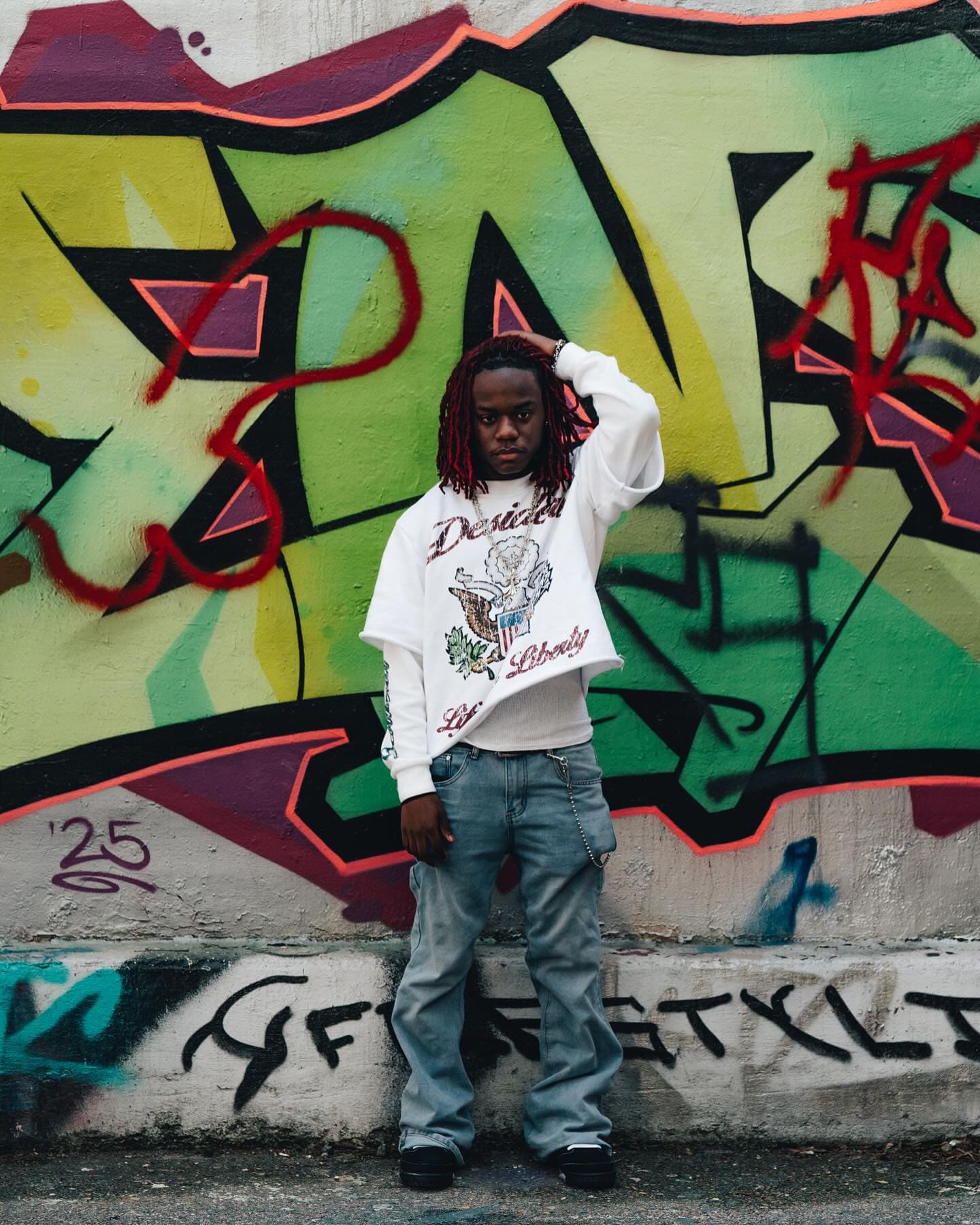 Front-on portrait against a green graffiti burner, Life & Liberty double sleeve